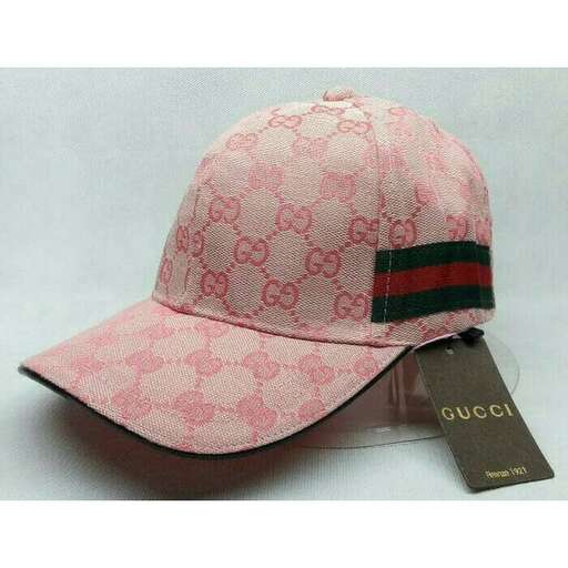 pink and black baseball cap with a tag