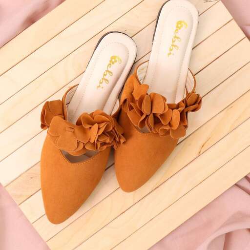 a pair of shoes with a floral pattern.