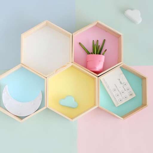 a colorful, pink, and blue box with a flower in it.