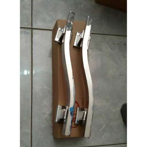 a pair of pliers on a wooden board.