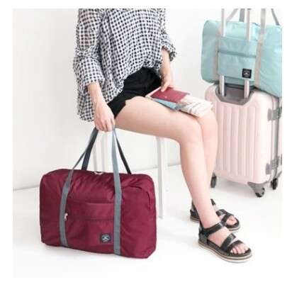 a woman sitting on a chair with a suitcase and a suitcase.