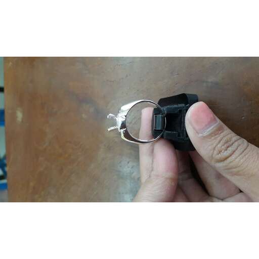 a person opening a key in a small hand.