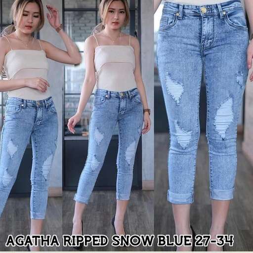 person in a crop top and jeans