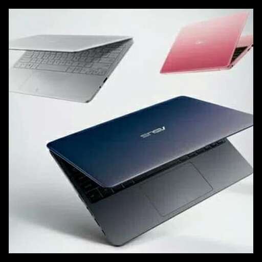 a laptop computer sitting on top of a box.