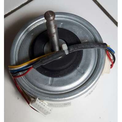 a metal container with wires and wires on the floor.