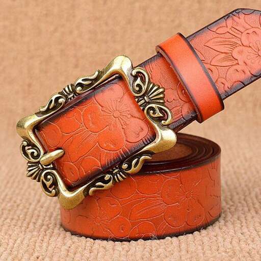 a beautiful orange and gold bracelet with a beautiful design.