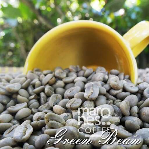 a cup of coffee with a yellow spoon