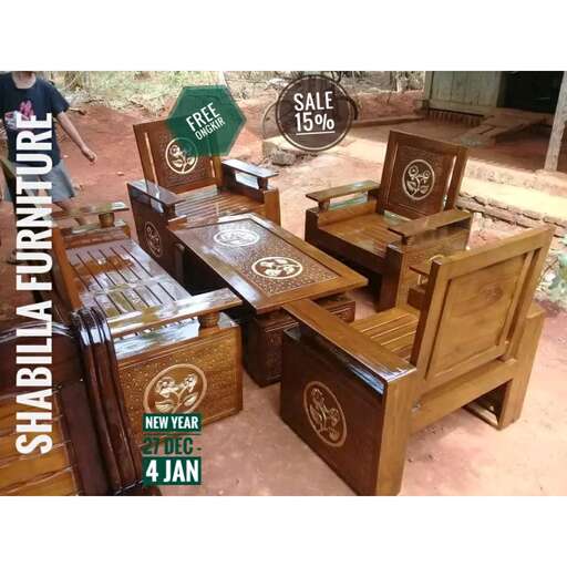 a wooden bench with a sign on it.