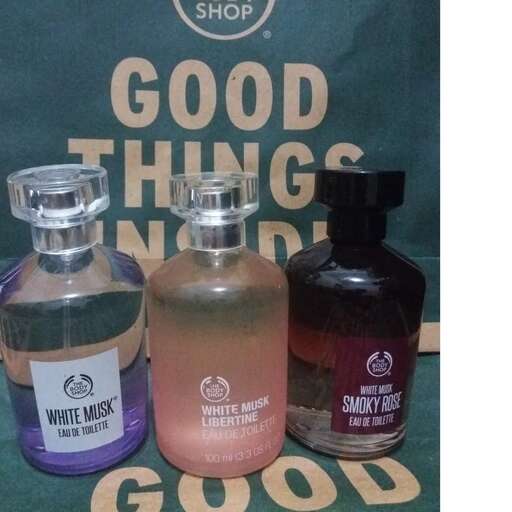 a collection of bottles of perfumes