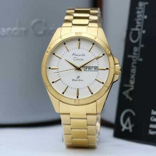 a gold watch with a black background.