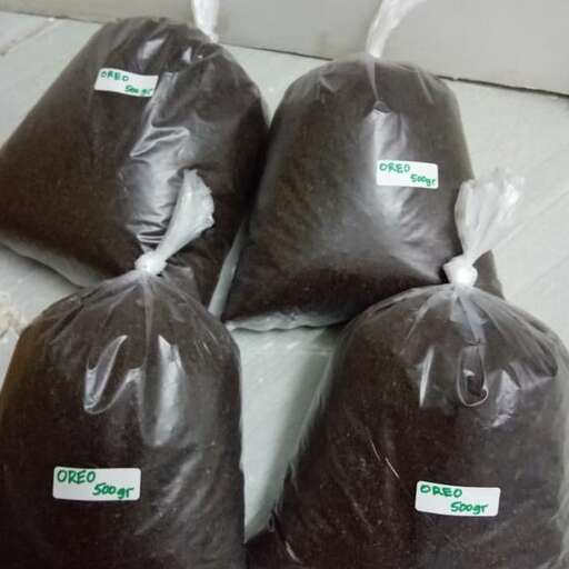 a couple of bags of black bags sitting on top of a white floor.