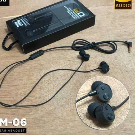 a black mp3 player with a plastic cover and headphones plugged into it.