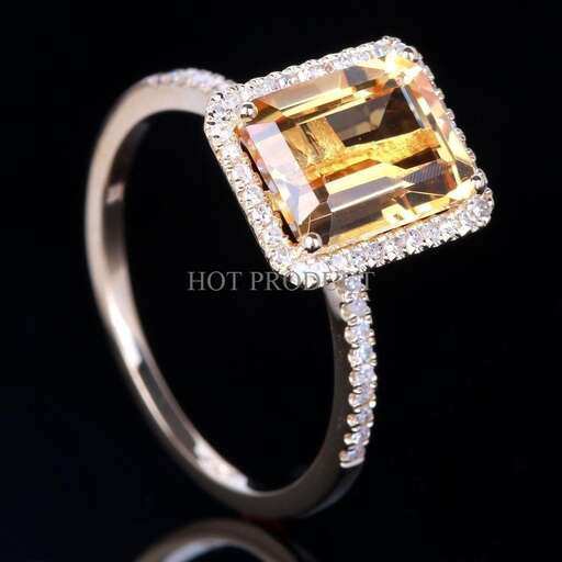 a diamond ring with a yellow diamond