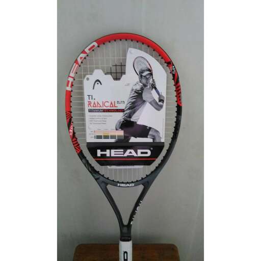 a tennis racket with a picture of a tennis player on it.