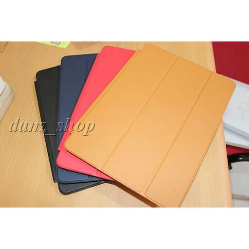 a stack of folded paper on a desk