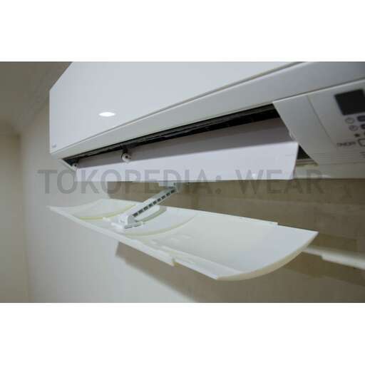 a printer is placed on a shelf in a room.