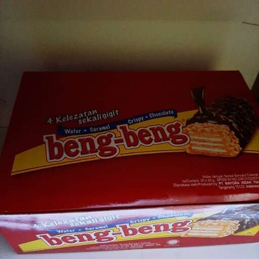 two boxes of food sitting on top of a shelf.