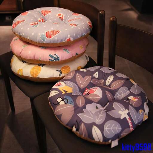 a collection of vintage pillows on a table in a shop in the old town of san francisco.