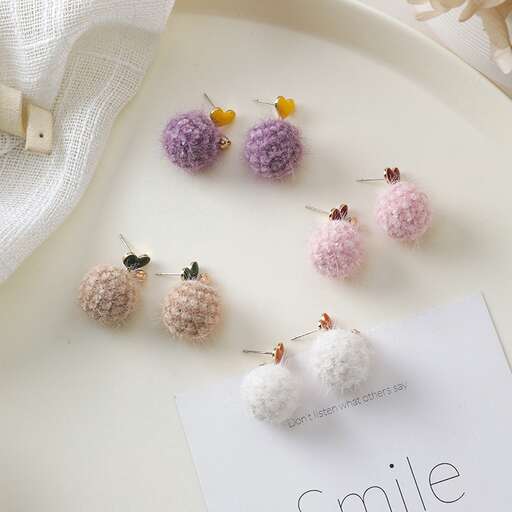 a set of three balls of yarn on a plate.