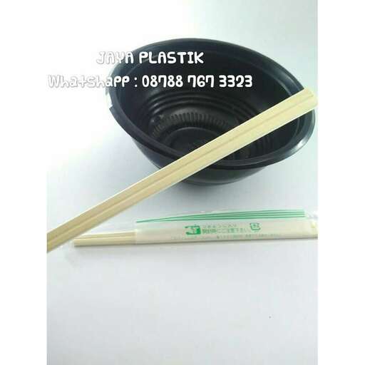 a pair of chopsticks sitting on a table.