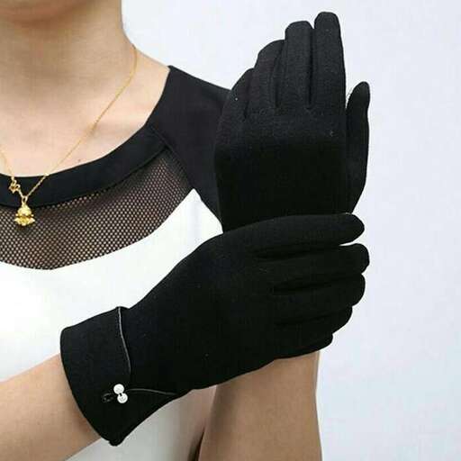 a black glove with a gold chain and a gold chain.