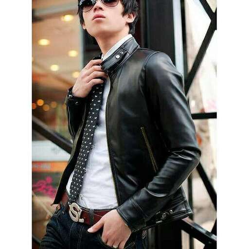 a man in a leather jacket and tie.