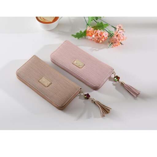 a small wallet with a zipper and a flower in the middle.