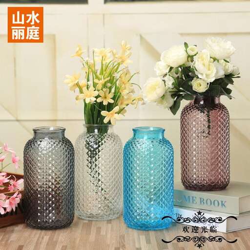 a set of three vases with flowers in them.