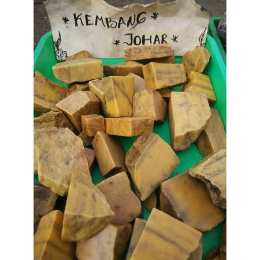 a street vendor selling fresh cut up potatoes.