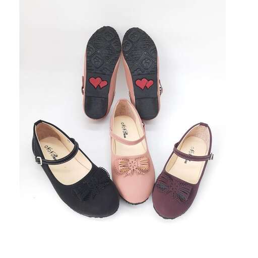 a pair of black shoes with a red heart on the sole.