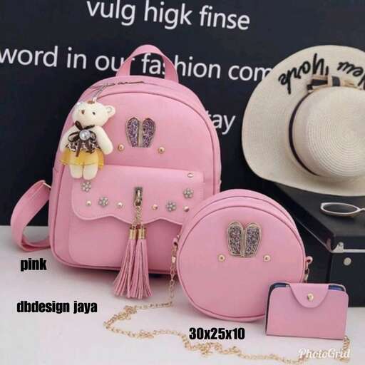 a pink backpack with a hat on it.