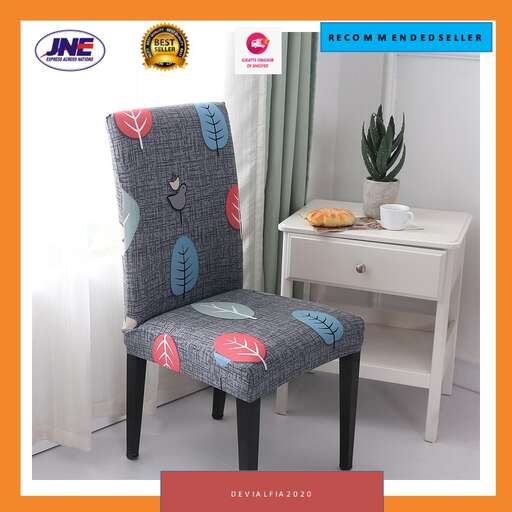 a chair with a blue and red pattern on it and a white desk in the background.