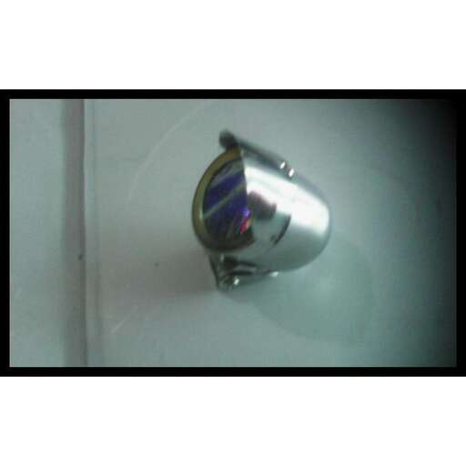 a silver soap dispenser in a bathtub.