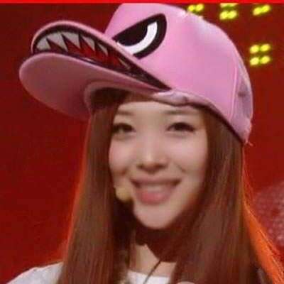 a girl in a pink hat