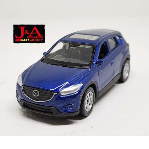 a blue car with a black logo on the front.