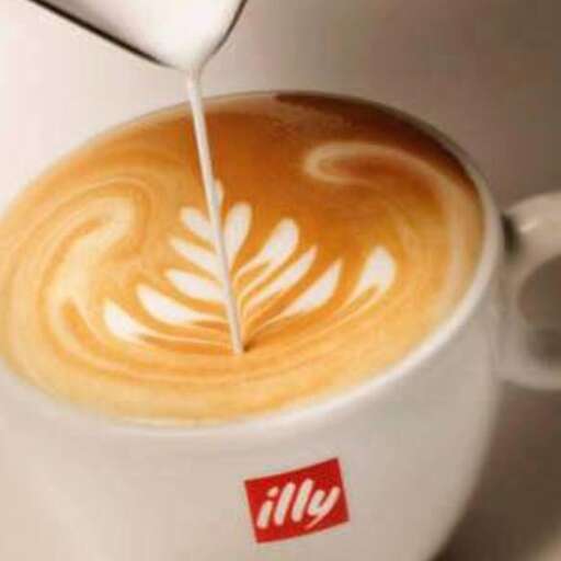 a cup of coffee with a spoon