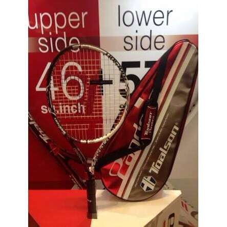 a tennis racket on a stand in a store