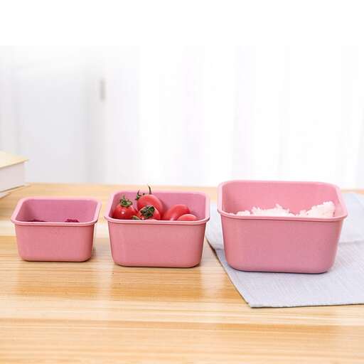 a table with three containers of food on it.