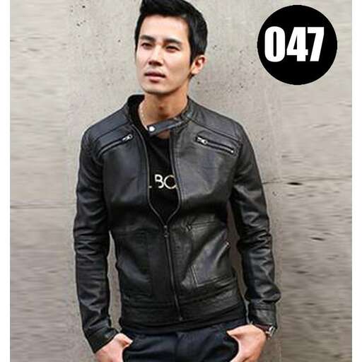 a man in a leather jacket holding a skateboard.