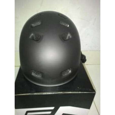 a black helmet with a silver light on it.