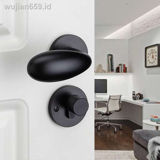 a white room with a white wall and a black lamp.