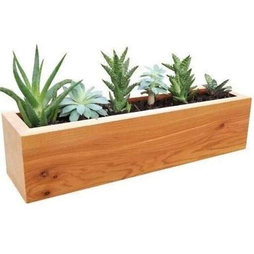 a wooden planter with a wooden planter on top of it.