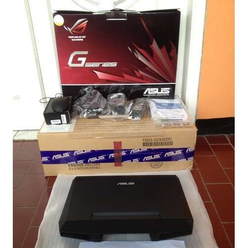 a box with a computer sitting on top of it.