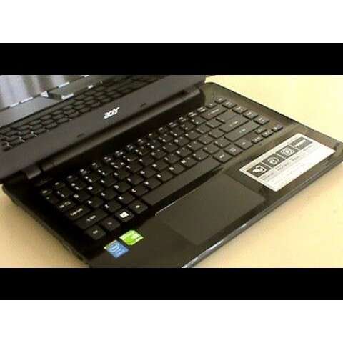a black laptop computer sitting on top of a desk.