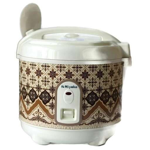 a white crock pot with a lid on top of it.