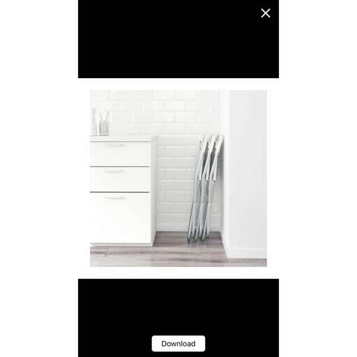 a white bathroom with a white brick wall and a white tile floor.