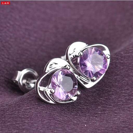 a pair of purple and pink earrings with a purple stone in the center.