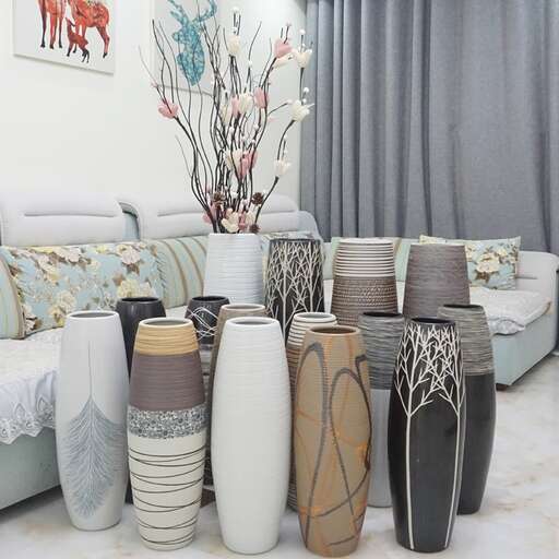 a living room filled with vases and a couch.