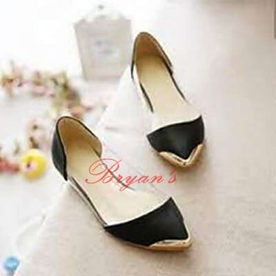 a pair of shoes with a white bow on the bottom.