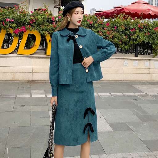 a woman in a green coat and hat